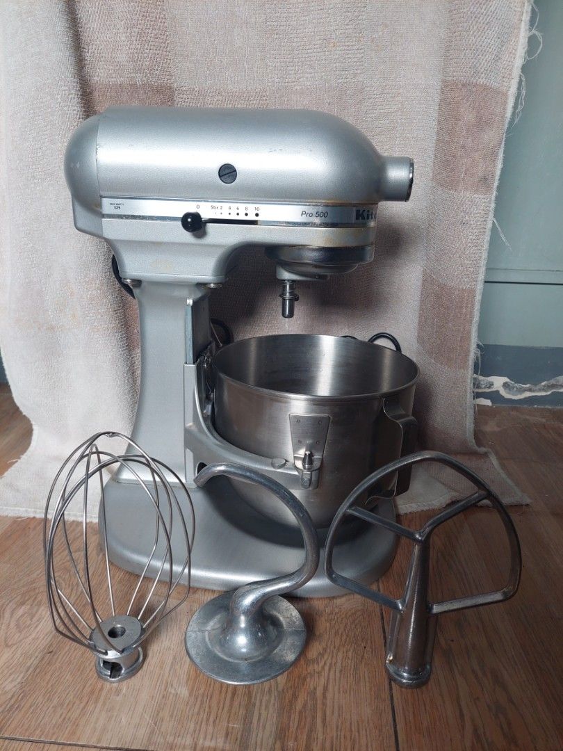 KitchenAid Stand Mixer Collection Multiple Models Available (Category: Hand & Stand Mixers) located in Pasig City. Submitted by brightocean_bb44a1 (Listing ID 1467977216, Image 2). Description: Variety of KitchenAid stand mixers lined up in different colors and capacities. Includes black, red, cream, white, silver, and grey units. Several bowls, wire whips, flat beaters, and dough hooks included across the lineup. Multiple motor sizes and power r