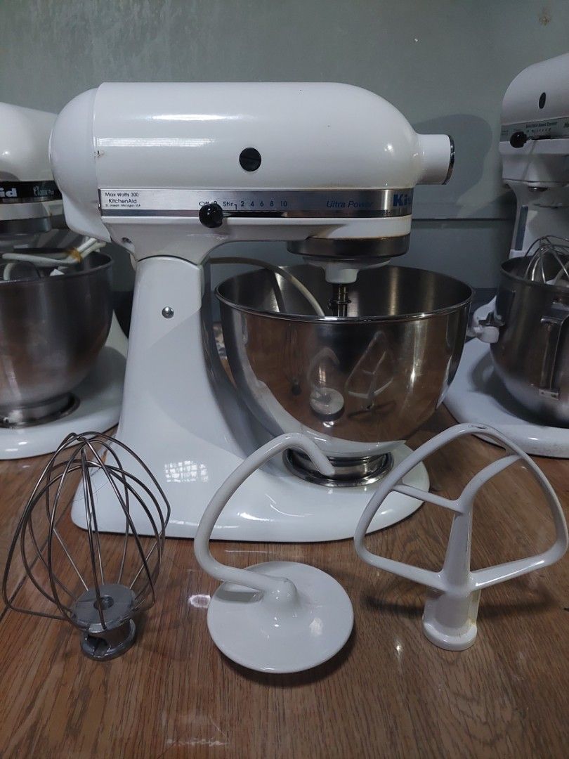 KitchenAid Ultra Power Stand Mixer White (Category: Hand & Stand Mixers) located in Pasig City. Submitted by brightocean_bb44a1 (Listing ID 1467976952, Image 3). Description: - Color: Classic White - Power: 300 watts, standard plug - Speeds: 10 versatile settings from stir to whip - Inclusions: Stainless steel bowl, flat beater, wire whip, and dough hook - Condition: Fully functional with minor cosmetic wear around the speed control lever and tri