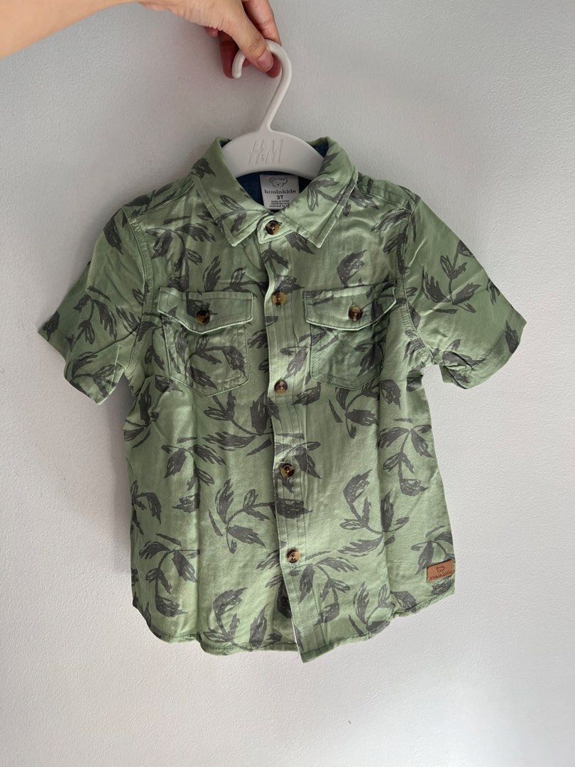 KOALA KIDS Green Leaf Print Button-Down Shirt (2-3t) (Category: Babies & Kids Fashion) located in Muntinlupa City. Submitted by uniquepicks (Listing ID 1467915554, Image 1). Description: Like New, used once Super lightweight! Fits 2-3 years old RFS: outgrown, decluttering Color may vary due to lighting. .