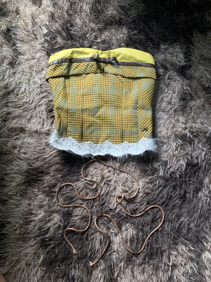 Koalar Yellow Plaid Corset Top (Category: Sleeveless) located in Cebu City. Submitted by selamethrift (Listing ID 1467950728, Image 1). Description: - Brand: Koalar - Design: Yellow plaid corset top with brown faux leather trim and cute front bow detail - Hem: White fluffy lace trim along the bottom - Closure: Front lace-up design with separate brown cords included - Interior: Fully lined with brown fabric for comfort.