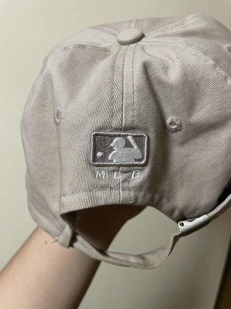 LA Dodgers Cap (Category: Caps & Hats) located in Pasig City. Submitted by randomclothes_ (Listing ID 1467949437, Image 2). Description: - Authentic MLB LA Dodgers baseball cap - Color: Beige with white embroidered LA logo - Classic curved brim and adjustable strap for a custom fit - Official Major League Baseball tag included - Clean fabric, 100% stain-free and undamaged.