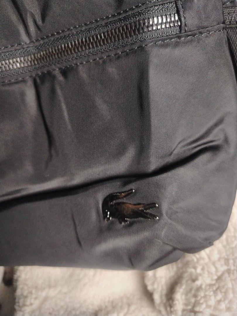Lacoste nylon back pack (Category: Backpacks) located in Roxas City. Submitted by hd_thriftshop (Listing ID 1467988223, Image 2). Description: Lacoste nylon back pack minimal flaws..