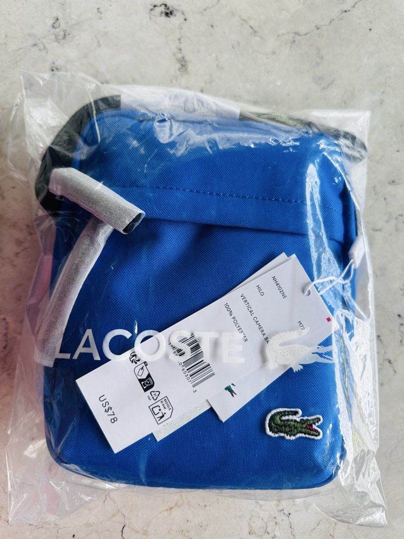 Lacoste Vertical Bag (Bundle price) (Category: Sling Bags) located in Cavite. Submitted by hennats (Listing ID 1467869523, Image 3). Description: 💰 SET PRICE: ₱6,000 only (LAST PRICE!) 📌 Sold as a set only. 🐊 FOR SALE | ORIGINAL LACOSTE BAGS 🇺🇸 💯 Authentic Lacoste – Bought in the USA! 🎨 Colors: Maroon & Blue ✨ PRODUCT HIGHLIGHTS: • Signature Lacoste appliqué logo • Adjustable shoulder strap • Front and top zip fastening • Spacious main com
