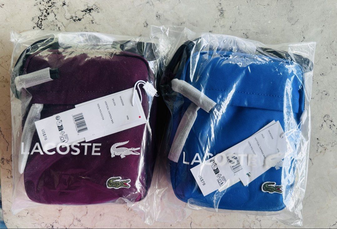 Lacoste Vertical Bag (Bundle price) (Category: Sling Bags) located in Cavite. Submitted by hennats (Listing ID 1467869523, Image 1). Description: 💰 SET PRICE: ₱6,000 only (LAST PRICE!) 📌 Sold as a set only. 🐊 FOR SALE | ORIGINAL LACOSTE BAGS 🇺🇸 💯 Authentic Lacoste – Bought in the USA! 🎨 Colors: Maroon & Blue ✨ PRODUCT HIGHLIGHTS: • Signature Lacoste appliqué logo • Adjustable shoulder strap • Front and top zip fastening • Spacious main com