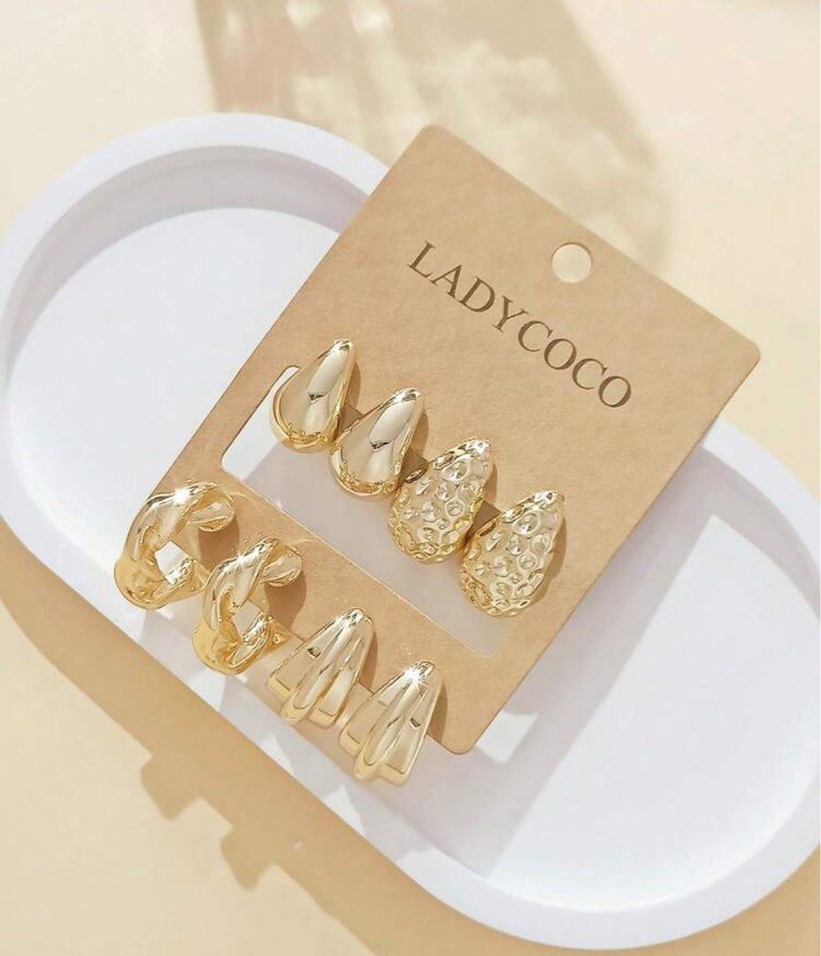 LADYCOCO Gold Chunky Teardrop Earring Set (Category: Earrings) located in Manila. Submitted by goddesssy (Listing ID 1467847400, Image 2). Description: - Brand: LADYCOCO (Brand new on original backing card) - Variety: Includes smooth teardrops, textured metallic finishes, twisted hoops, and chunky curved styles - Comfort: Bold statement pieces designed to be very lightweight for all-day wear - Perfect for daily styling or gifting.