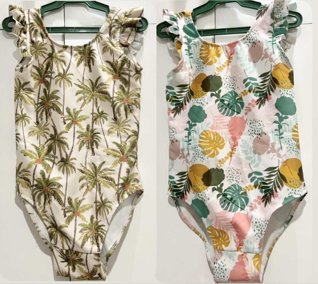 Laila and Lyra Swimsuit TAKE BOTH (Category: Babies & Kids Fashion) located in Quezon. Submitted by prettydesyembre (Listing ID 1467944107, Image 1). Description: - Set of 2 adorable one-piece swimsuits for little girls - Prints: Green palm trees on one, colorful tropical leaves and abstract shapes on the other - Design: Playful ruffled shoulder straps and classic scoop neck - Material: Stretchy, comfortable fabric ideal for swimming - Perfect fo