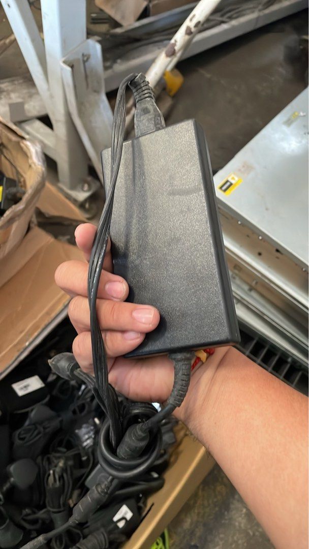 Laptop Power Adapter Charger (Category: Chargers) located in Calamba. Submitted by jozamvibar76665 (Listing ID 1467862218, Image 2). Description: - Authentic Dell 130W laptop charger (black power brick with attached power cord and barrel plug) - Standard US two-prong wall plug included - Pulled from a working corporate environment and fully tested - Reliable power supply for compatible Dell laptops - Bulk stock available if you need multiple unit