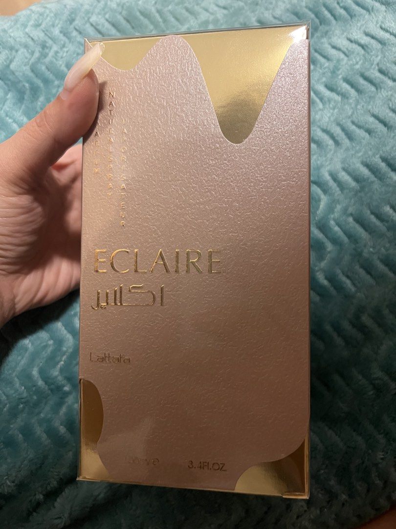 Lattafa Eclaire Eau De Parfum 100ml (Category: Fragrance & Deodorants) located in Angeles City. Submitted by ldmtrading (Listing ID 1468022180, Image 2). Description: - Brand: Lattafa - Fragrance Name: Eclaire - Type: Eau de Parfum (Natural Spray / Vaporisateur) - Volume: 100ml / 3.4 fl. oz. - Condition: Brand new, still wrapped in original clear plastic shrink wrap - Packaging: Stunning gold and pink textured box.