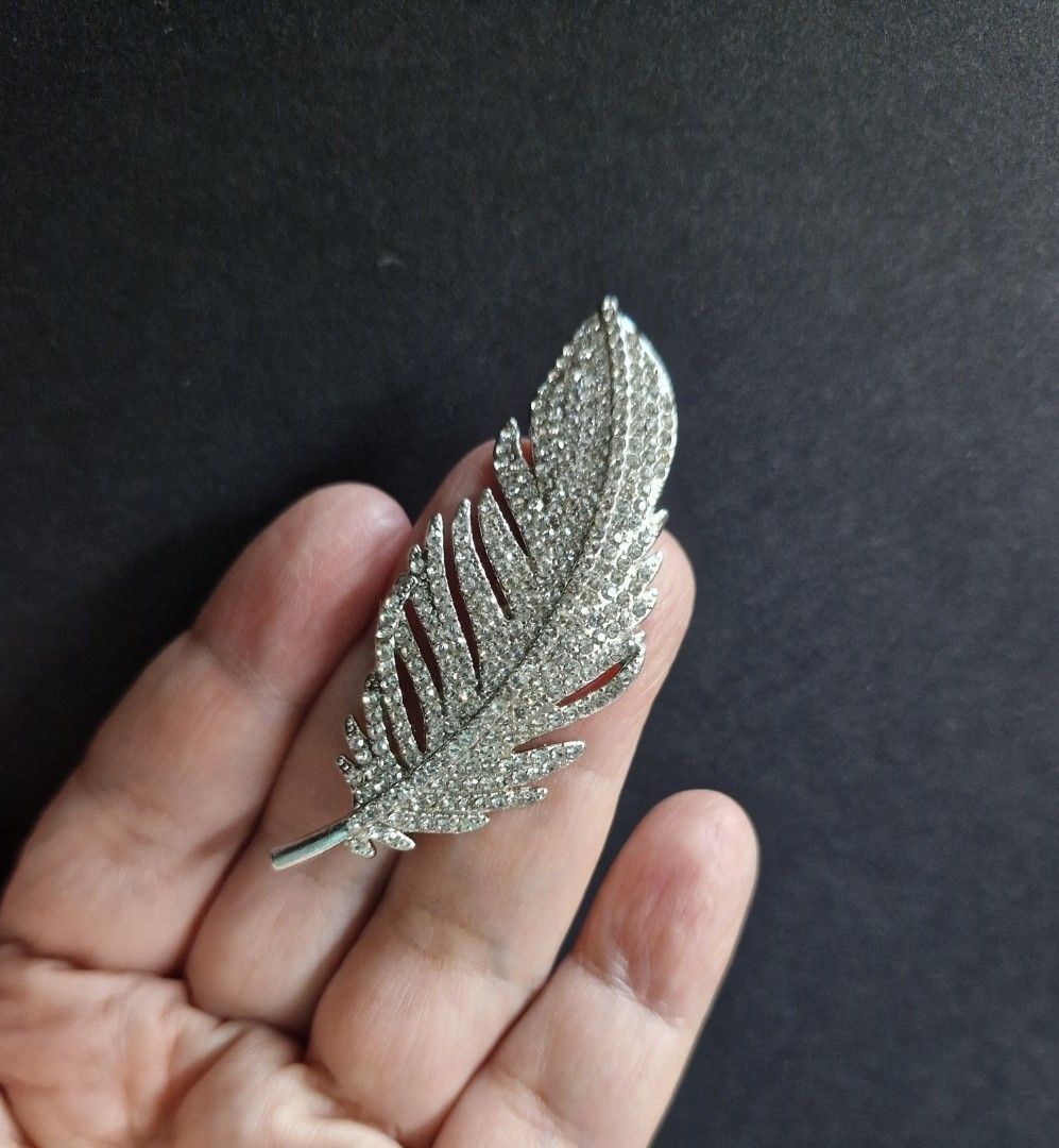 Leaf Brooch (Category: Brooches) located in Taguig. Submitted by mommaschoice (Listing ID 1467945715, Image 2). Description: Brand New Adorned w/ clear rhinestones Silver-Tone finish Lightweight won't damage the fabric Ships nationwide.