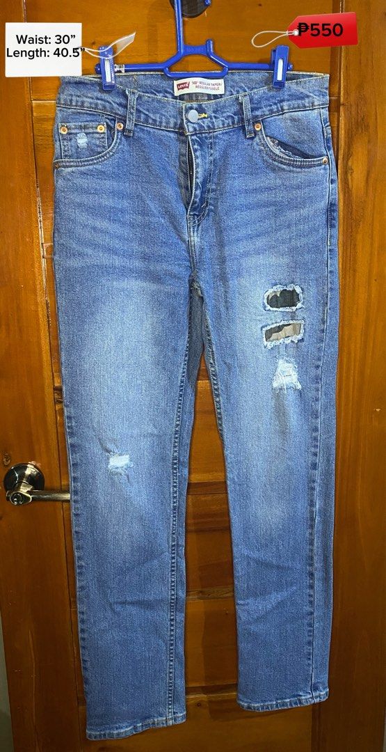 Levi's 502 Regular Taper Distressed Jeans (Category: Jeans) located in Baguio. Submitted by heath2600 (Listing ID 1468029079, Image 1). Description: - Brand/Model: Levi's 502 Regular Taper Jeans - Color/Wash: Medium wash blue - Design Details: Distressed with unique camo patches on the left thigh and subtle wear on the right pocket - Closure: Classic button fly - Size Measurements: Waist 30 inches | Length 40.5 inches - Condition: Excellent, styl