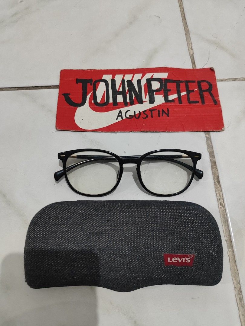 Levi's Black Round Eyeglasses frame with Case (Category: Sunglasses & Eyewear) located in Tuguegarao City. Submitted by johnpetera0818 (Listing ID 1468024025, Image 1). Description: - Brand: Levi's - Style: Round frames, black with gold metal temple accents - Model: BLK 53-18-145 - Fit: Lightweight and comfortable for daily wear - Lenses: Clear lenses currently installed (ready for your grade) - Inclusion: Original denim hard case with iconic Lev