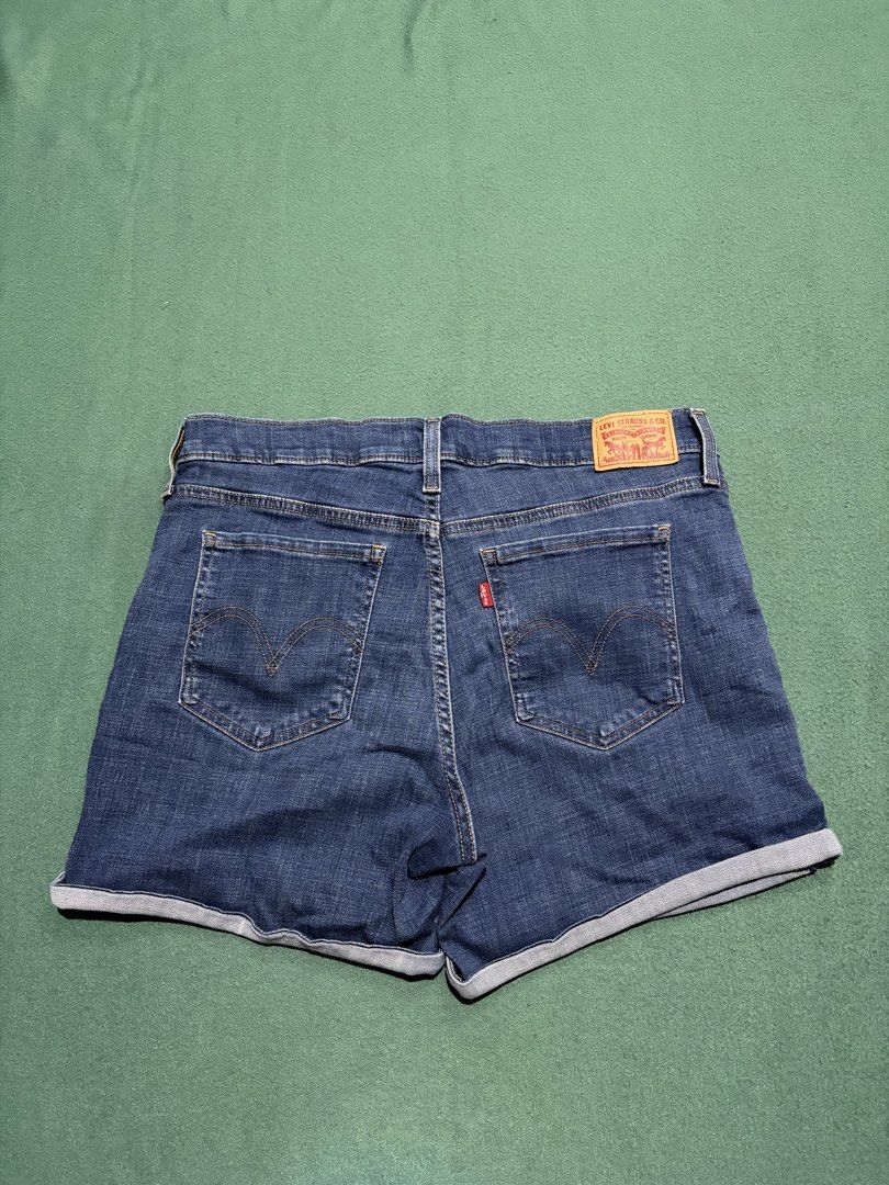 Levi's Denim Shorts Cuffed Blue (Category: Shorts) located in Guihulngan. Submitted by fbthriftgoodsniace (Listing ID 1467917398, Image 1). Description: - Brand: Levi's - Style: Classic five-pocket denim shorts with rolled cuffs - Wash: Medium blue - Size: Measures ~16 inches across waist (flat lay) - Details: Iconic red tab on back pocket and leather waistband patch - Material: Durable cotton blend denim - Condition: Great everyday basic - Size 