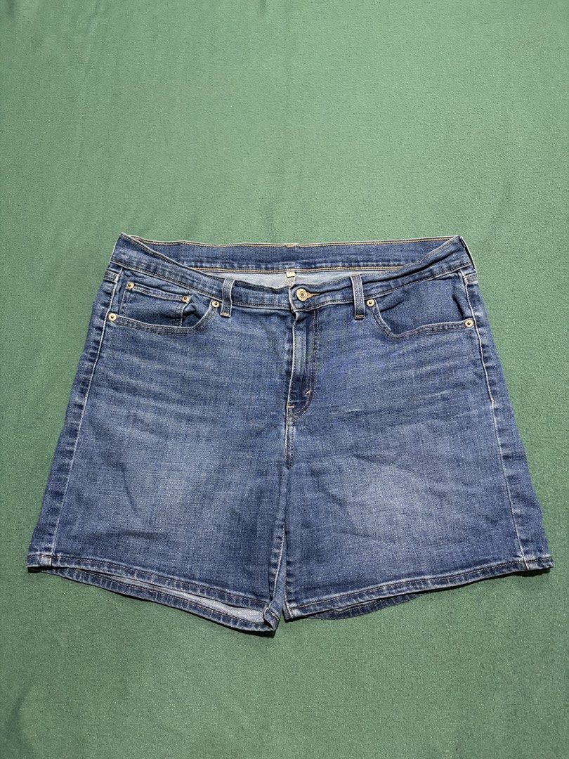 Levi's Denim Shorts Size 32 (Category: Shorts) located in Guihulngan. Submitted by fbthriftgoodsniace (Listing ID 1467917991, Image 2). Description: - Brand: Levi's - Style: Classic denim shorts - Size: 32 - Color/Wash: Medium blue wash - Features: Five-pocket styling, zipper fly, button closure, leather back patch, and signature red tab - Condition: Shows standard pre-loved wear, perfect for casual everyday use.