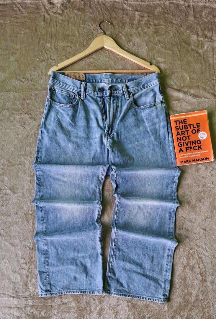 Levi’s Light Wash Straight Denim Jeans (Category: Jeans) located in Alaminos. Submitted by made.by (Listing ID 1464568731, Image 2). Description: Waist Measurement: 16 in flat lay (Fits Size 31–32 in) ​Outseam Length: 40.5 in ​Fit: Straight Leg Cut ​Condition: Good Used Condition (Has a small hole flaw on the lower right leg area; clean light wash fading).