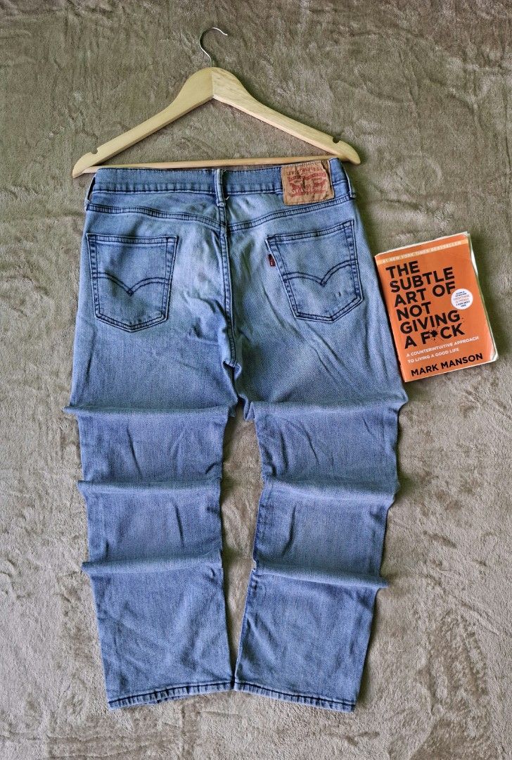 Levi’s Light Wash Straight Denim Jeans (Category: Jeans) located in Alaminos. Submitted by made.by (Listing ID 1464568731, Image 3). Description: Waist Measurement: 16 in flat lay (Fits Size 31–32 in) ​Outseam Length: 40.5 in ​Fit: Straight Leg Cut ​Condition: Good Used Condition (Has a small hole flaw on the lower right leg area; clean light wash fading).