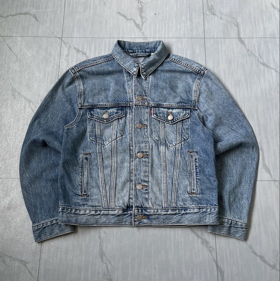 Levi's Premium Trucker Denim Jacket (Authentic) (Category: Coats, Jackets and Outerwear) located in Cavite. Submitted by newclassicwear (Listing ID 1467924953, Image 2). Description: Size S On Tag (20width 24length) Excellent Condition None Any Issue 9.8 Honest Color Rate Can Do Meet Up Around Sm Tanza Cavite Tanza📍 Authentic Levi's Premium Trucker Denim Jacket in medium wash. Classic style with metal buttons, chest pockets, and side welt pocket