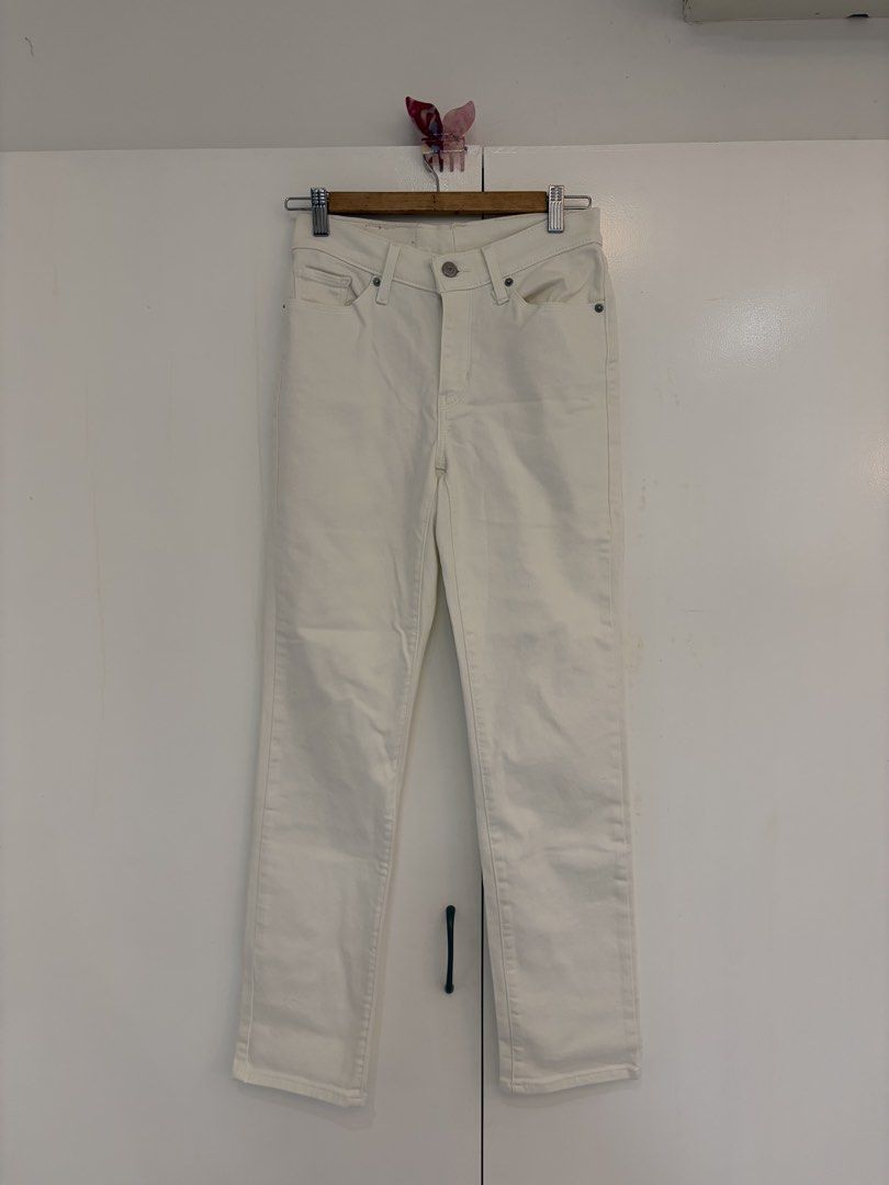 Levi's White Straight Leg Jeans (Category: Jeans) located in Quezon City. Submitted by prelovedbynxkole (Listing ID 1467880491, Image 1). Description: - Brand: Levi's - Color: Neutral off-white / white - Fit: Straight leg cut - Details: Classic leather back patch, signature red tab, front button closure, belt loops - Pockets: Standard five-pocket styling - Condition: Clean fabric with minimal wear - Style Tip: Versatile neutral piece that goes wi