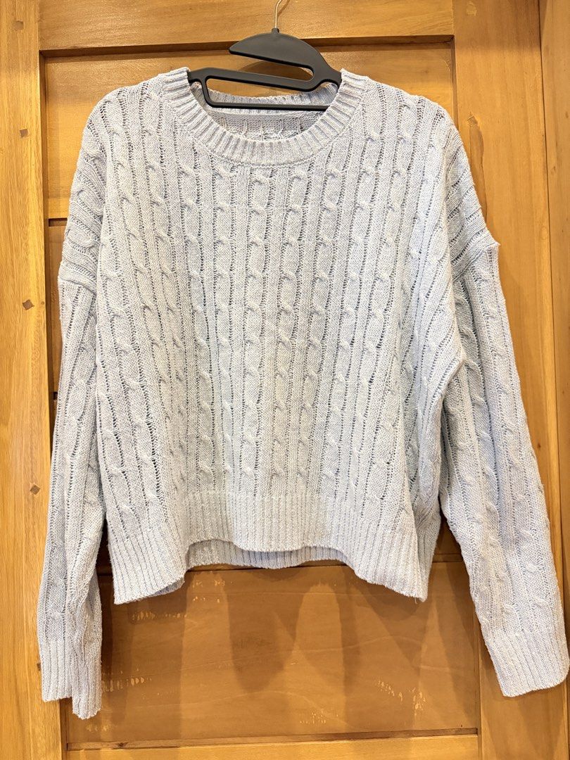 Light blue cable knit sweater (Category: Longsleeves) located in Bacoor. Submitted by caramelcart (Listing ID 1468000730, Image 1). Description: - Color: Light Blue - Pattern: Classic cable knit - Fit: Relaxed drop-shoulder - Details: Round neckline, ribbed cuffs and hem - Material: Soft and cozy knit - Style Tip: Great for cooler weather, easily pairs with jeans or skirts.