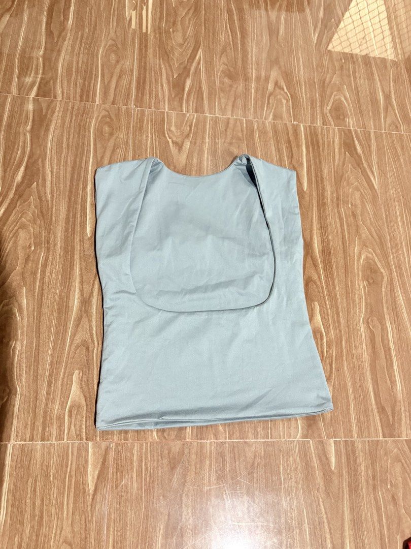 Light Blue Sleeveless Top With Square Neckline (Category: Sleeveless) located in Manila. Submitted by thriftwithgem (Listing ID 1467898119, Image 2). Description: - Color: gray - Design: Sleeveless with a stylish scoop back and deep curved neckline - Never been used -Size: Medium.