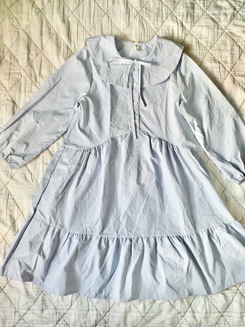 Light Blue Tiered Mini Doll Dress (Category: Dresses) located in Bacoor. Submitted by krisery (Listing ID 1467946589, Image 2). Description: - Color: Light Blue/Powder Blue - Style: Tiered mini dress with long sleeves - Size: Free Size (Fit Small to Large) - Details: Oversized Peter Pan collar with a cute bow tie and front button placket - Chest: 18 inch - Length: 35.5 inch - Fit: Comfortable elastic cuffs and a fun, bouncy gathered skirt - Funct