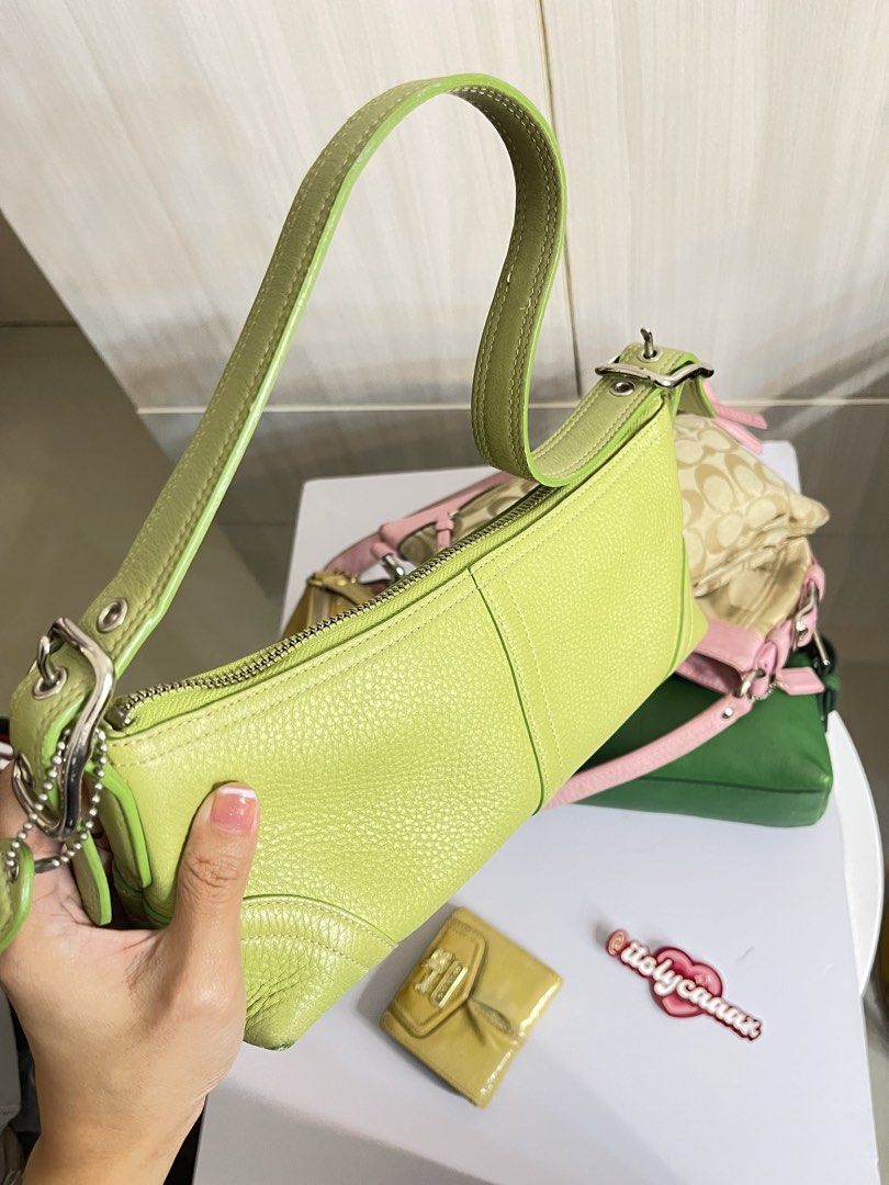 Lime Green Coach Leather Shoulder Bag (Category: Luxury Bags & Wallets) located in Manila. Submitted by lycahatesyou (Listing ID 1467995037, Image 2). Description: - Brand: Coach - Material: Lime green pebble leather - Hardware: Silver - Closure: Zip top with hanging tag - Shape: Structured rectangular with front seam details - Interior: Fits daily essentials easily - Condition: Minor corner wear visible on the bottom edges.