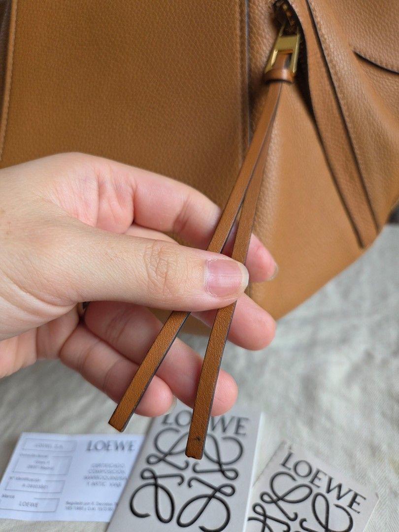 Loewe Hammock Small (Category: Luxury Bags & Wallets) located in Quezon City. Submitted by shop.mar.go (Listing ID 1467910127, Image 3). Description: excellent condition loewe hammock small size with dust bag and paper cards interior very clean, no foul smell exterior has minor signs of usage but tolerable 9/10 excellent condition.