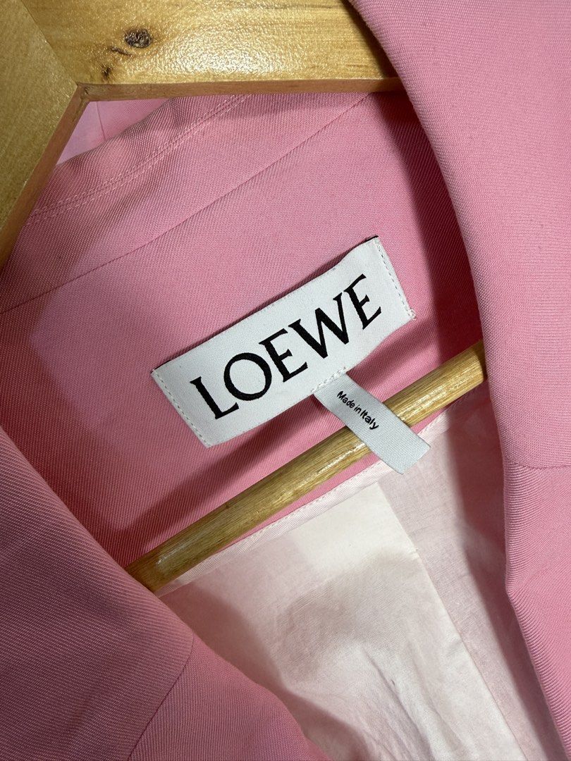 Loewe Pink Viscose Elastane Blazer Jacket Size L (Category: Coats, Jackets and Outerwear) located in Dasmarinas. Submitted by arjalaph (Listing ID 1467897436, Image 2). Description: - Brand: Loewe - Color: Pastel Pink - Size: L (Tag attached) - Origin: Made in Italy - Fit: Classic tailored fit with clean structured shoulders - Details: Single button closure, front welt pockets, fully lined interior.