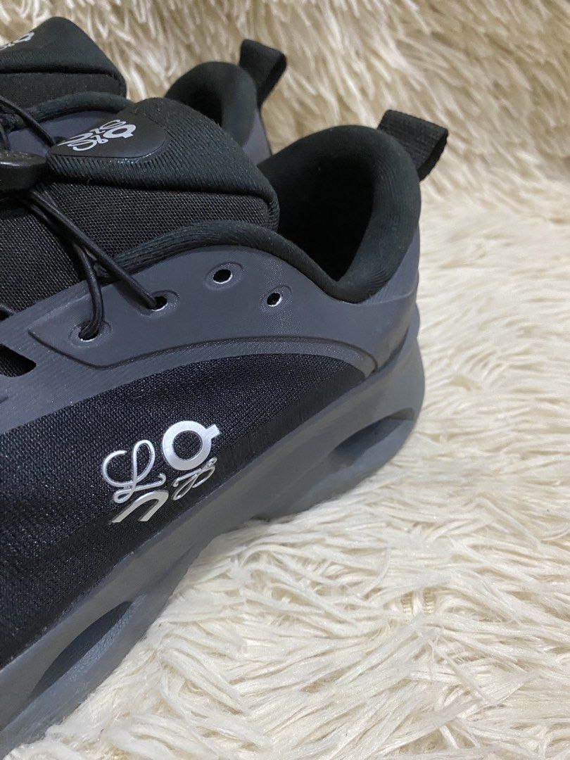 Loewe x On Cloudtilt Black Grey Sneakers (Category: Sneakers) located in Manila. Submitted by switchcity (Listing ID 1467878293, Image 3). Description: - Authentic Loewe x On Cloudtilt collaboration sneakers - Colorway: Sleek Black and Dark Grey - Slip-on design with elastic bungee lacing and toggle adjustment - Lightweight mesh upper with durable synthetic overlays - Signature cutout sole for ultimate cushioning and unique style - Distinctive Lo
