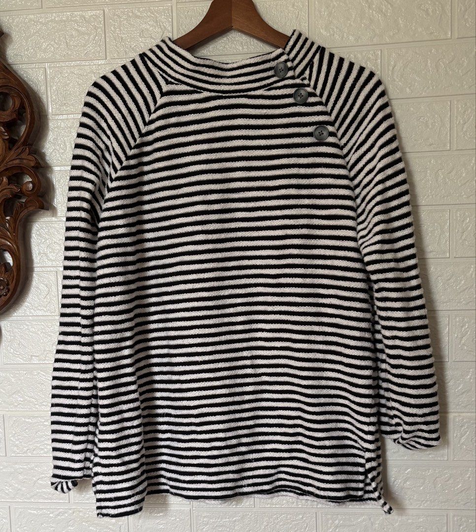 LOFT Black and White Striped Button-Neck Sweater Size M (Category: Longsleeves) located in Batangas. Submitted by purple_and_orange (Listing ID 1467862863, Image 1). Description: - Brand: LOFT - Style: Black and white striped sweater with mock neck - Detail: Three decorative buttons on the side shoulder - Material: 100% breathable cotton knit - Fit: Relaxed fit with long sleeves - Size: M - Care: Machine washable - Origin: Made in India.