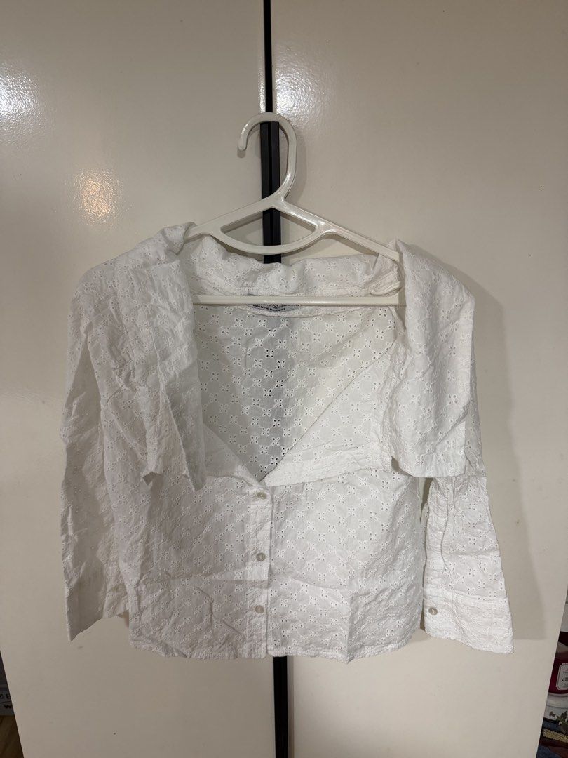 lola & daisies off shoulder top (Category: Blouses) located in Quezon City. Submitted by meowww000 (Listing ID 1467932176, Image 3). Description: - Brand: Lola & Daisies - Style: Ceara Broderie Eyelet Top - Color: Clean White - Size: Small (S) - Design: Off-shoulder foldover collar, button-down front, and long sleeves - Details: All-over intricate cutout embroidery patterns - Origin: Made in the Philippines - Condition: Excellent / Ready to ship.