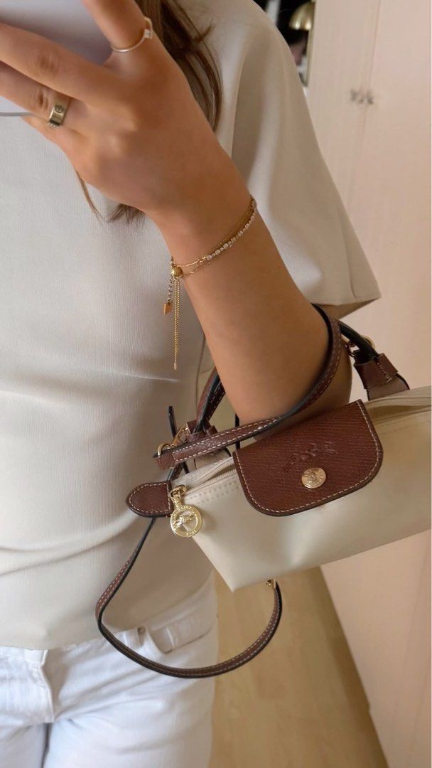Long champ beige white Mini (Category: Cross-body Bags) located in Manila. Submitted by theiconicco_mnl_8 (Listing ID 1468053080, Image 1). Description: .