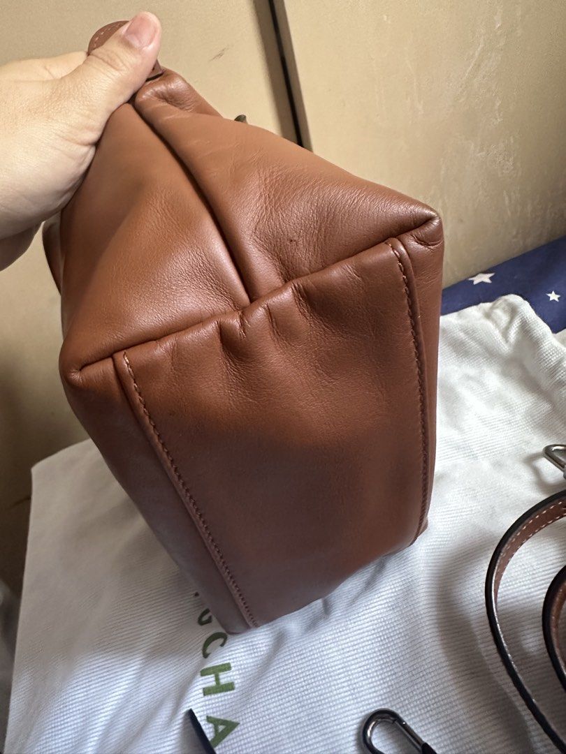 Longchamp Brown Leather Top Handle Bag (Category: Luxury Bags & Wallets) located in Manila. Submitted by prelovedwelllove (Listing ID 1467855758, Image 2). Description: 100% authentic Dustbag, paperbag and receipt Bought from HK longchamp boutique 9/10 condition, excellent condition Minimal sign of usage Cognac color Spacious Srp: 30k Rfs:declutter ,too much bag.