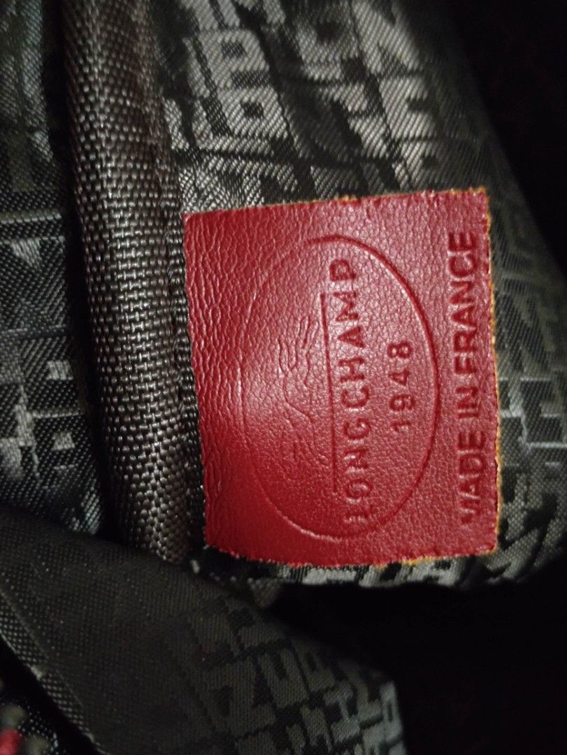 Longchamp Soft leather - Red with nylon strap (Category: Luxury Bags & Wallets) located in Quezon City. Submitted by pprzi_89 (Listing ID 1467890858, Image 3). Description: + shipping fee - Top short handle - Nylon adjustable shoulder strap - Condition: Brand new.