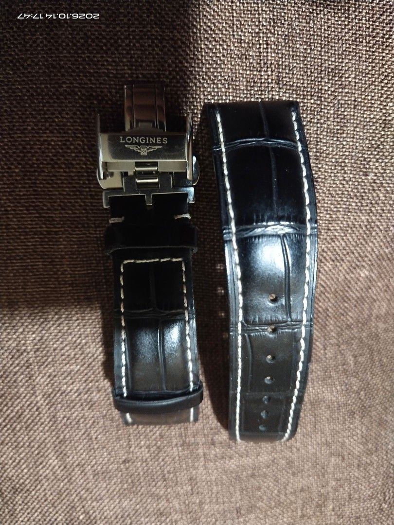 Longines Black Leather Watch Strap with Deployment Clasp (Category: Men's Watches) located in Tuba. Submitted by drickbernard (Listing ID 1467933501, Image 1). Description: - 100% genuine Longines black leather watch strap - Features stylish white contrast stitching and clean grain texture - Includes stainless steel deployment clasp with engraved winged hourglass logo - Reference numbers: L682100666 (strap) and L600136236 (clasp) - Lug width: 21m