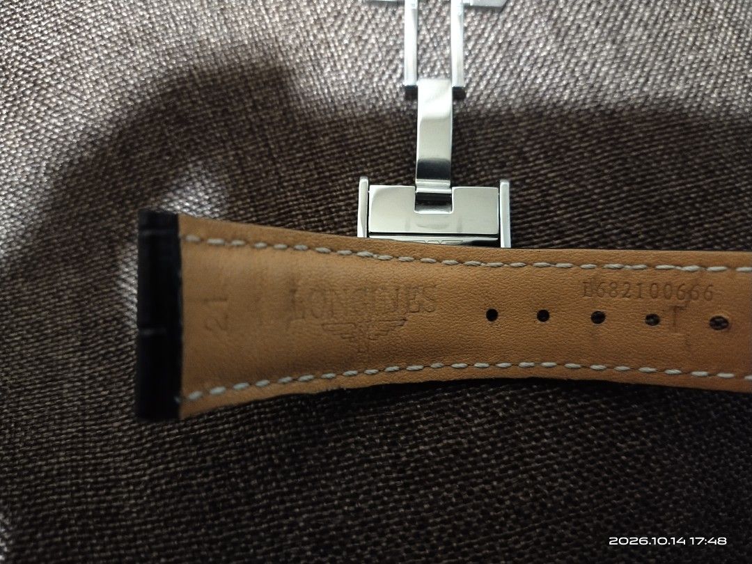 Longines Black Leather Watch Strap with Deployment Clasp (Category: Men's Watches) located in Tuba. Submitted by drickbernard (Listing ID 1467933501, Image 3). Description: - 100% genuine Longines black leather watch strap - Features stylish white contrast stitching and clean grain texture - Includes stainless steel deployment clasp with engraved winged hourglass logo - Reference numbers: L682100666 (strap) and L600136236 (clasp) - Lug width: 21m
