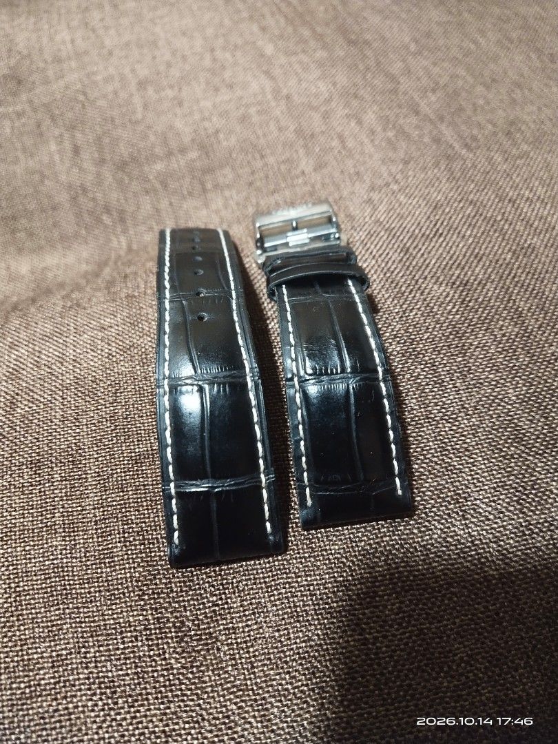 Longines Black Leather Watch Strap with Deployment Clasp (Category: Men's Watches) located in Tuba. Submitted by drickbernard (Listing ID 1467933501, Image 2). Description: - 100% genuine Longines black leather watch strap - Features stylish white contrast stitching and clean grain texture - Includes stainless steel deployment clasp with engraved winged hourglass logo - Reference numbers: L682100666 (strap) and L600136236 (clasp) - Lug width: 21m