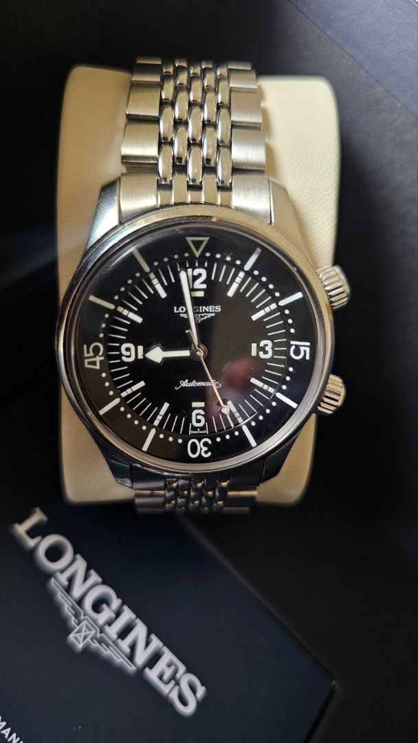 Longines Legend Diver 39MM, Black Dial (Category: Luxury Watches) located in Quezon City. Submitted by laramuao36882 (Listing ID 1467846321, Image 3). Description: - Model: Longines Legend Diver (Ref. L3.764.4) - Movement: Automatic - Dial & Details: Classic black dial with a date window at 3 o'clock and distinctive dual crowns - Bracelet: Original steel mesh bracelet - Case Back: Iconic diver engraving - Inclusions: Complete with original Longin