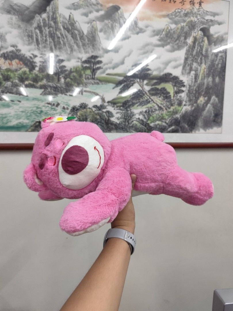 Lotso Bear Pink Plush Toy (Category: Plushies & Soft Toys) located in Iloilo. Submitted by elenmenope (Listing ID 1467879224, Image 1). Description: - Bright pink Lotso bear plush toy - Features a cute white muzzle, dark pink nose, and stitched smile - Adorned with a small floral decoration on the head - Made of ultra-soft, clean fabric - Ideal as a gift or cute room decor.