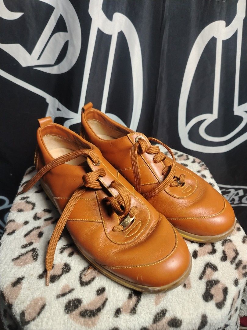 Louis Vuitton (Category: Casual Shoes) located in Roxas City. Submitted by hd_thriftshop (Listing ID 1467990876, Image 1). Description: tan-brown leather Louis Vuitton LV Butter Soft low-top sneakers featuring yellow contrast stitching and the "LOUIS VUITTON" logo debossed on the side of the rubber sole Size 6 1/2.