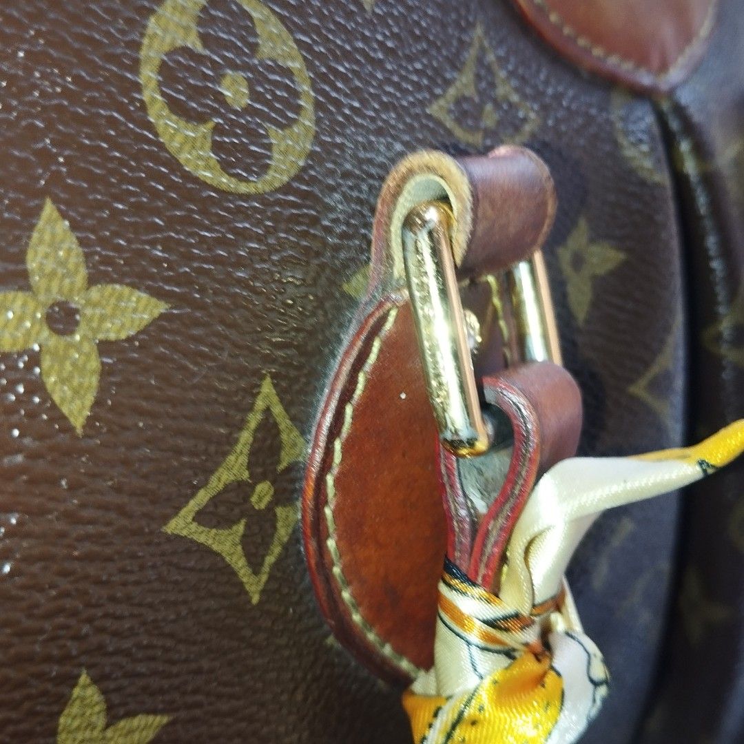Louis Vuitton Monogram Canvas Tote Handbag (Category: Tote Bags) located in Manila. Submitted by lene48 (Listing ID 1467895341, Image 3). Description: - Classic Monogram canvas with rich brown leather trim and gold-tone hardware - Secure zippered top closure with dual handles for easy carrying - Pre-styled with chic decorative twilly scarves and a dangling LV charm - Spacious interior to fit all your daily essentials effortlessly - Perfect everyd