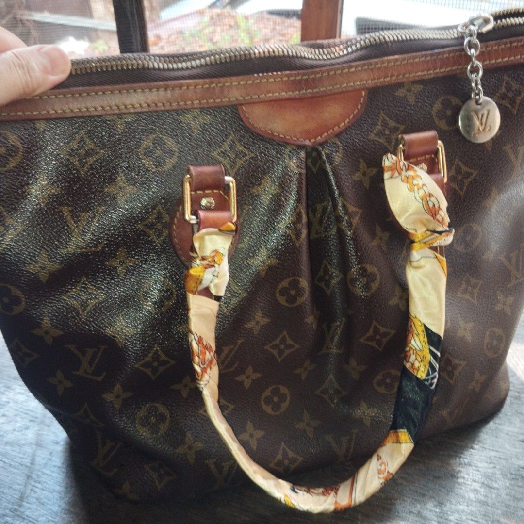Louis Vuitton Monogram Canvas Tote Handbag (Category: Tote Bags) located in Manila. Submitted by lene48 (Listing ID 1467895341, Image 1). Description: - Classic Monogram canvas with rich brown leather trim and gold-tone hardware - Secure zippered top closure with dual handles for easy carrying - Pre-styled with chic decorative twilly scarves and a dangling LV charm - Spacious interior to fit all your daily essentials effortlessly - Perfect everyd
