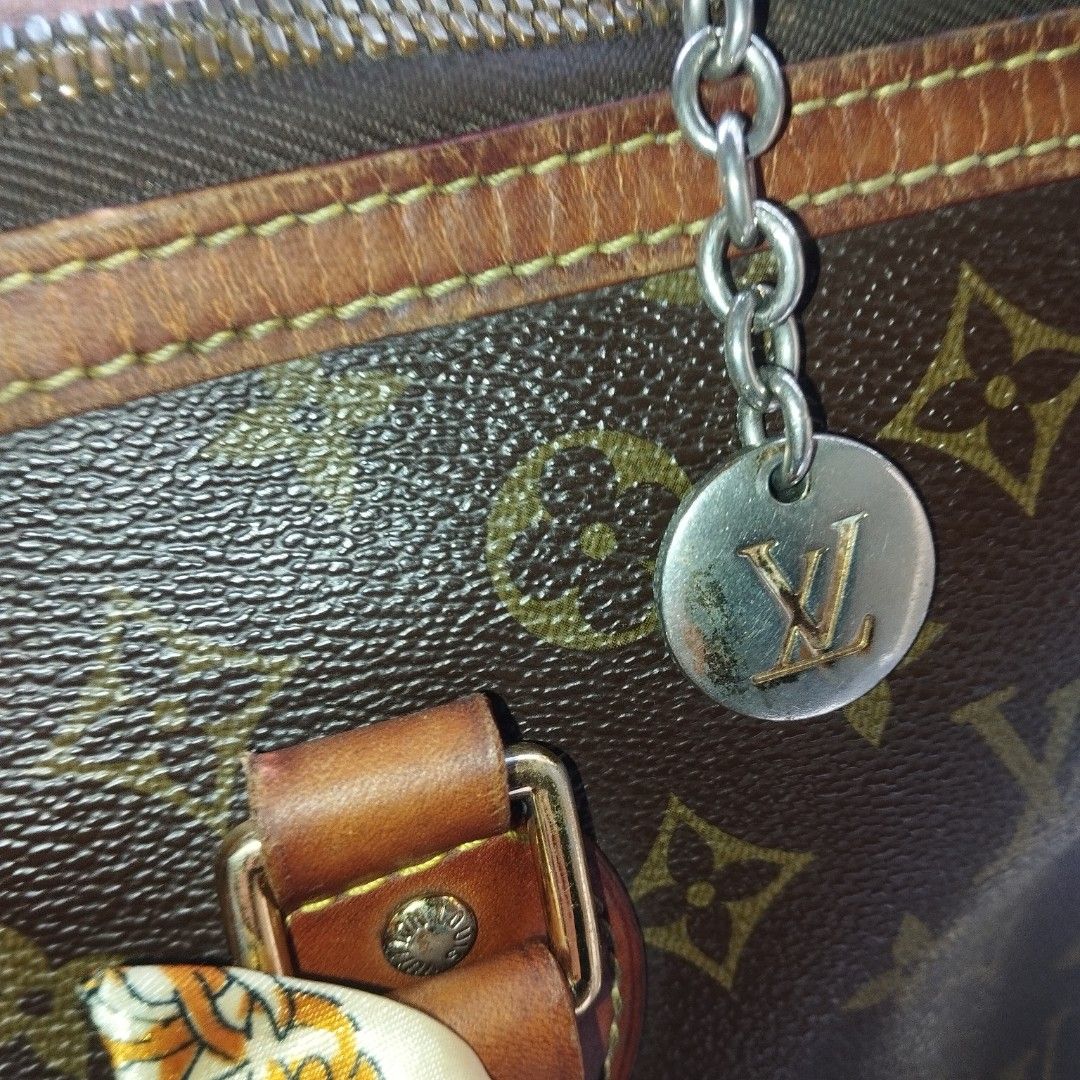 Louis Vuitton Monogram Canvas Tote Handbag (Category: Tote Bags) located in Manila. Submitted by lene48 (Listing ID 1467895341, Image 2). Description: - Classic Monogram canvas with rich brown leather trim and gold-tone hardware - Secure zippered top closure with dual handles for easy carrying - Pre-styled with chic decorative twilly scarves and a dangling LV charm - Spacious interior to fit all your daily essentials effortlessly - Perfect everyd