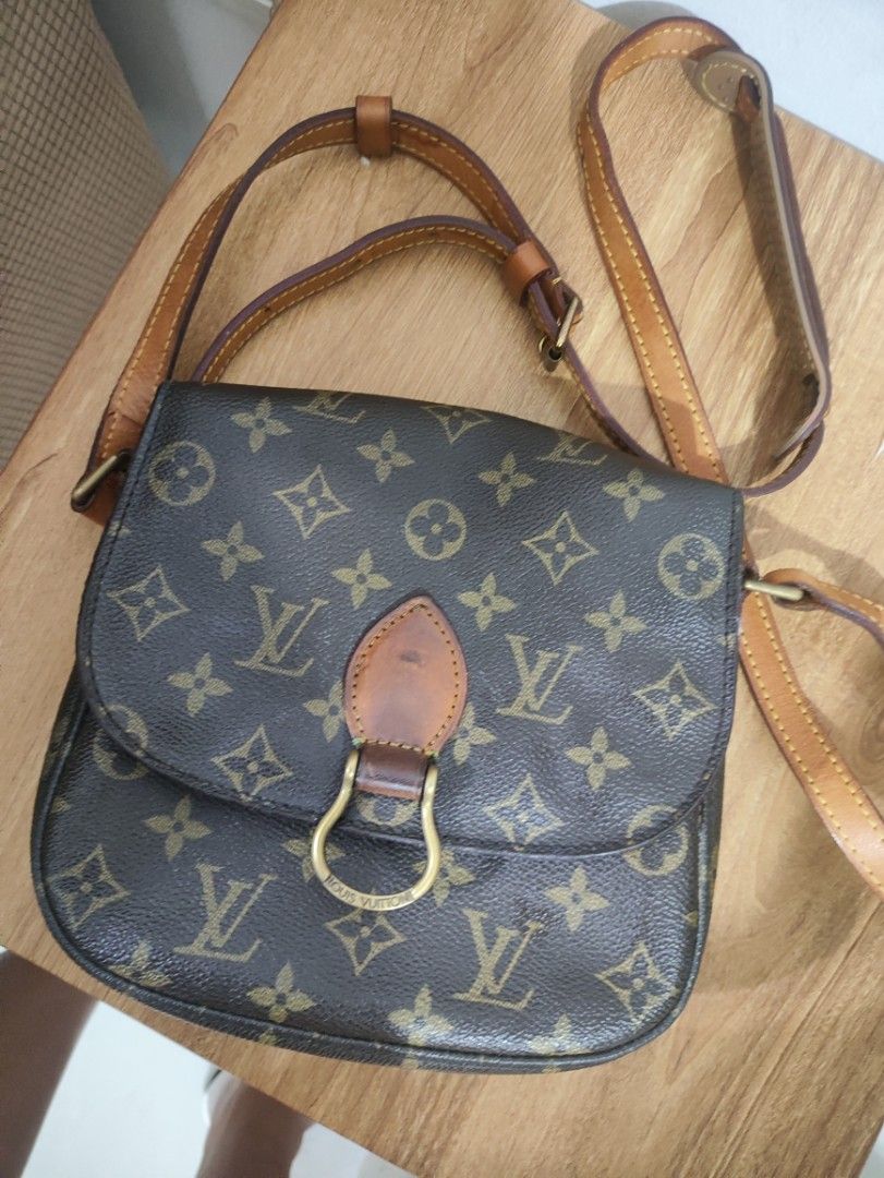 Louis Vuitton Monogram Canvas Crossbody Bag (Category: Luxury Bags & Wallets) located in Davao. Submitted by jenpolinar (Listing ID 1467973077, Image 1). Description: - Authentic Louis Vuitton monogram canvas crossbody bag - Classic brown canvas with signature print and vachetta leather trim - Adjustable shoulder strap for comfortable wear - Front flap closure with gold-tone LV stamped hardware ring - Natural patina on the leather tab with minor 