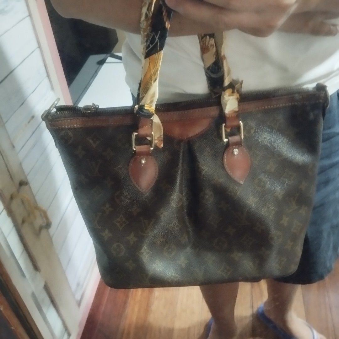 Louis Vuitton Monogram Canvas Tote Handbag (Category: Luxury Bags & Wallets) located in Manila. Submitted by lene48 (Listing ID 1468059080, Image 2). Description: - Authentic-style classic brown Monogram canvas tote bag - Premium leather trim with gold-tone zipper closure - Stylish wrapped handles featuring a printed twilly scarf accessory - Structured shape with a dark brown textile-lined interior - Signature embossed Louis Vuitton leather patch