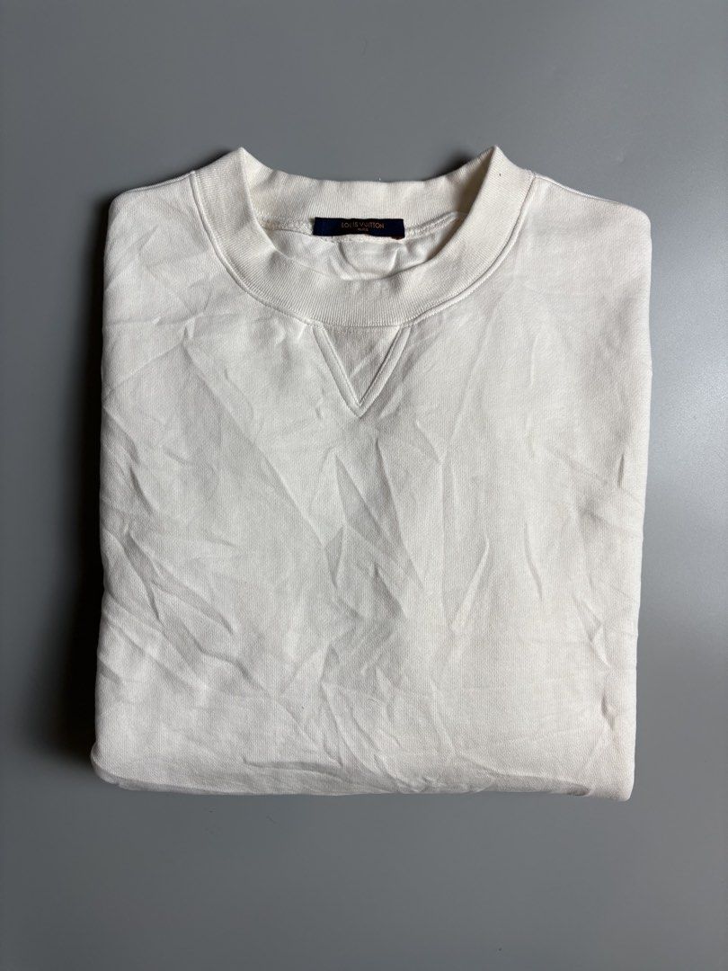 Louis Vuitton White Sweatshirt XL (Category: Coats, Jackets and Outerwear) located in Manila. Submitted by livefalcon-c64e (Listing ID 1467944300, Image 1). Description: - Brand: Louis Vuitton - Item: Crewneck Sweatshirt - Size: XL - Color: White - Material: Soft cotton fleece (Made in Italy) - Design: Classic crewneck with stitched V-insert, interior neck label, and outer back brown label detail - Features: Long sleeves with ribbed cuffs and hem
