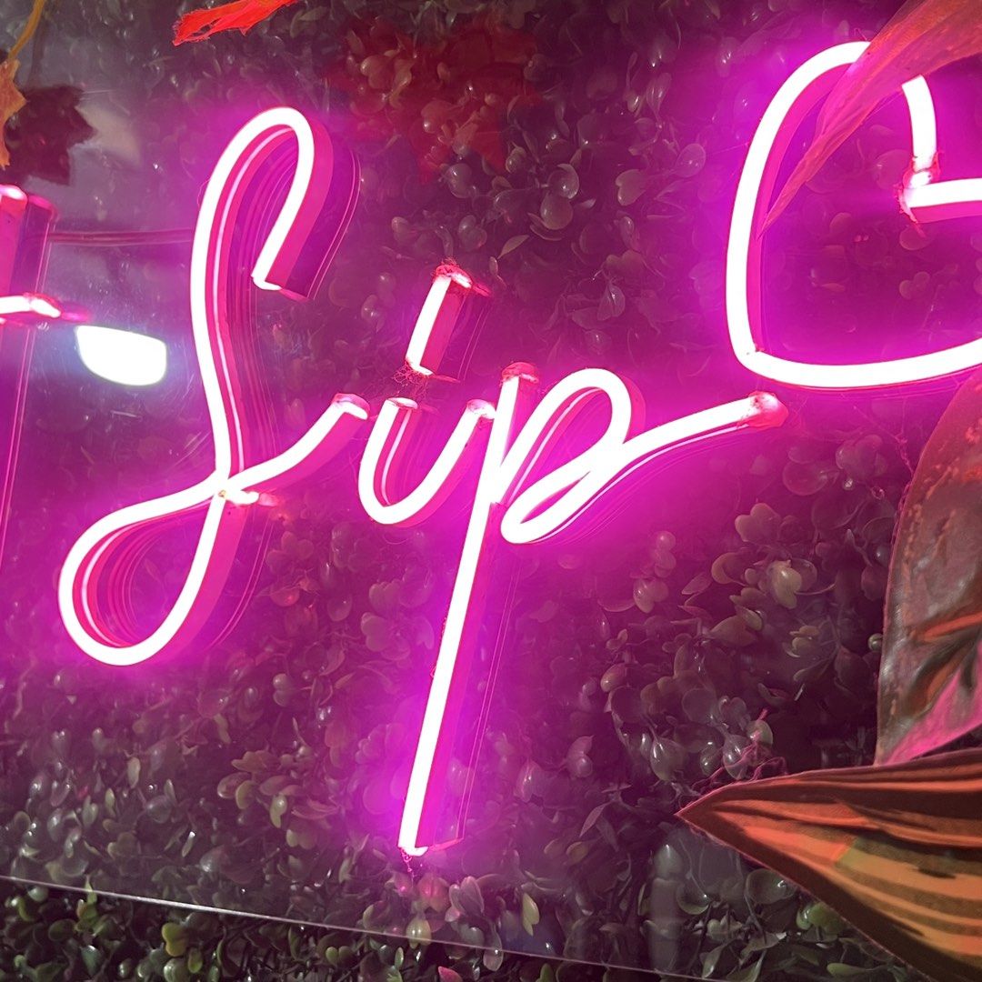 Love at First Sip LED Neon Sign (Category: Wall Decor) located in Cavite. Submitted by kkuumma (Listing ID 1467878498, Image 3). Description: - Bright pink LED neon sign with the text "Love at First Sip" - Mounted on a durable clear acrylic backing - Fully functional with a beautiful, vibrant glow - Ideal aesthetic decor for cafes, bars, or bedrooms - Easy to hang on any wall - Conveniently powered via cable.