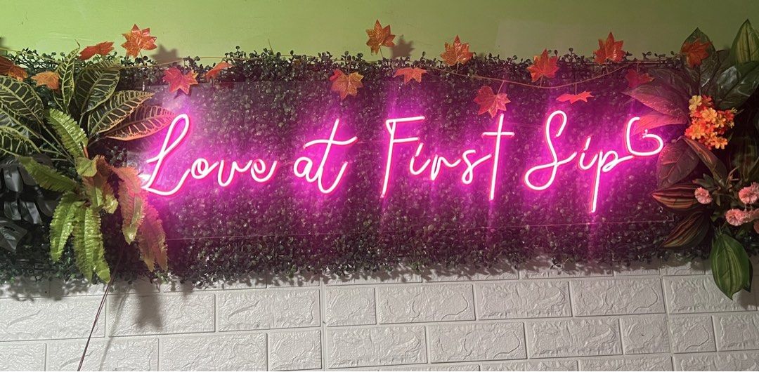 Love at First Sip LED Neon Sign (Category: Wall Decor) located in Cavite. Submitted by kkuumma (Listing ID 1467878498, Image 2). Description: - Bright pink LED neon sign with the text "Love at First Sip" - Mounted on a durable clear acrylic backing - Fully functional with a beautiful, vibrant glow - Ideal aesthetic decor for cafes, bars, or bedrooms - Easy to hang on any wall - Conveniently powered via cable.