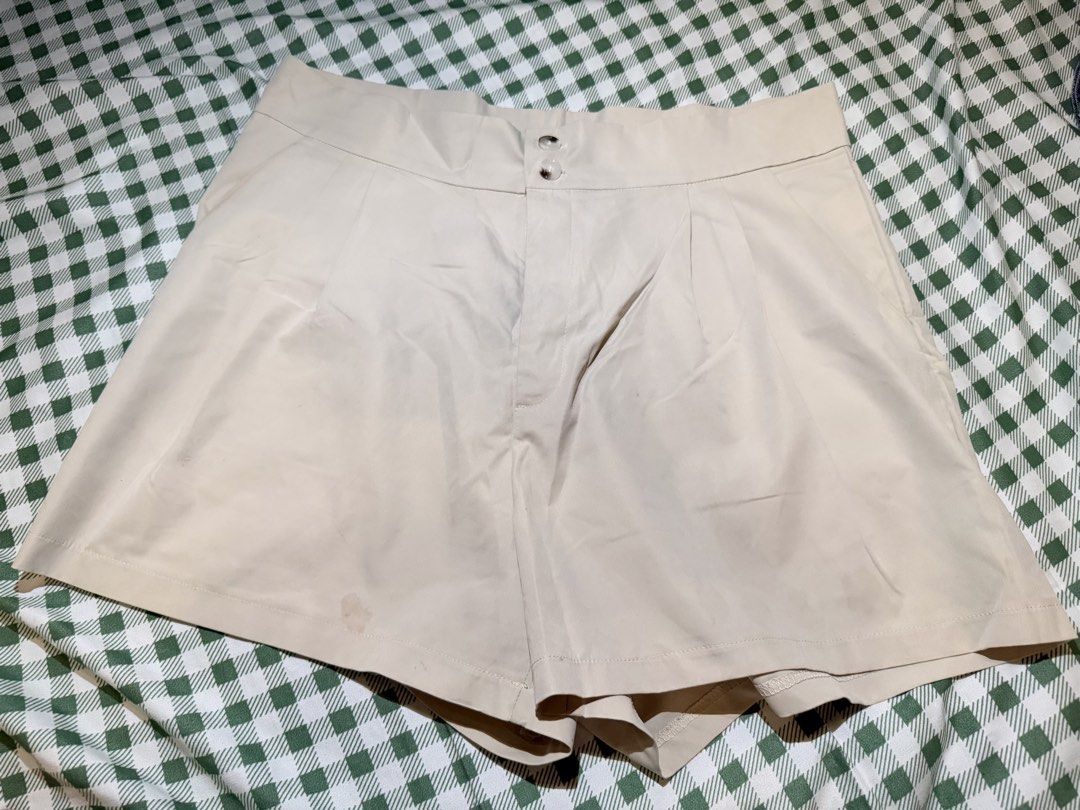 Lovito Beige Shorts Size 2XL EU48 US16 (Category: Shorts) located in San Miguel. Submitted by matchalatte23_ (Listing ID 1467997634, Image 1). Description: - Brand: Lovito - Size: 2XL (EU 48, US 16) - Color: Light beige (easy to match with any top) - Details: Double button front waist closure with pleated accents - Condition: Pre-loved with visible faint stains near the bottom hem (kindly check photos for reference) - Perfect for daily casual fit