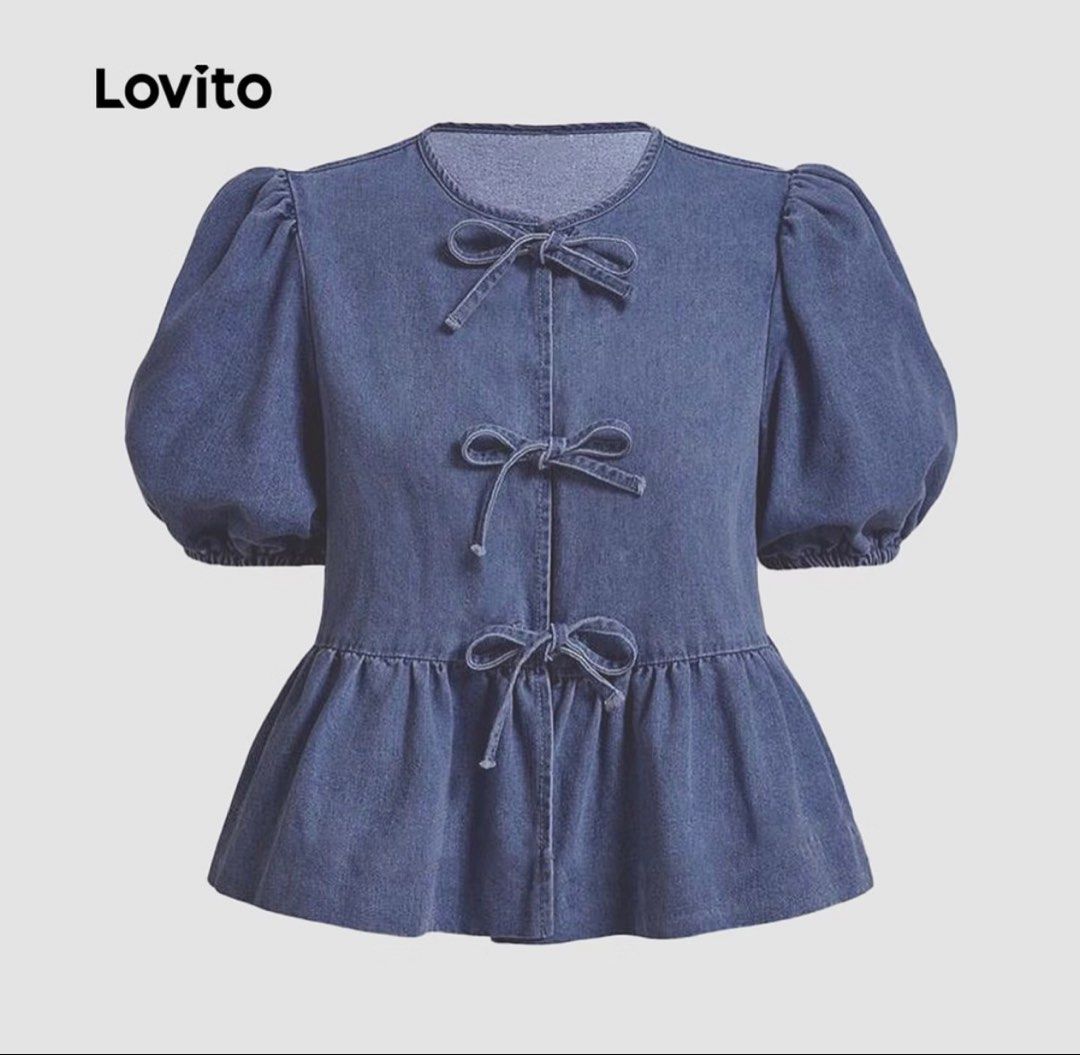 Lovito Denim Bow Front Peplum Blouse (Category: Blouses) located in Cebu City. Submitted by via_xoxo (Listing ID 1467997653, Image 1). Description: - Brand/Style: Lovito denim blouse in a dark blue wash - Sleeves: Short puff sleeves - Neckline: Round neck with button-down front - Accents: Three adorable tied bow details on the front - Fit: Structured silhouette with a flared peplum hem - Back: Solid design - Condition: Brand new / Excellent quali