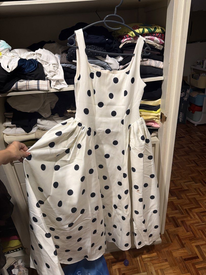 LTT Studio White Polka Dot Midi Dress Size L (Category: Dresses) located in Quezon City. Submitted by branded_closet01 (Listing ID 1467965788, Image 2). Description: White midi dress covered in black polka dots. Thick satin-like fabric with structured hip details and square neckline. Sleeveless style with back zipper closure. Brand tag shows LTT Studio, size L. Can fit M. Very good quality like apartment 8..